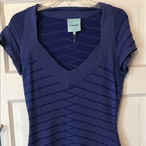 Blue dress, knee length (slightly above)